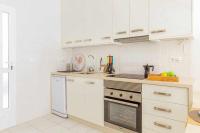 Kuchyň nebo kuchyňský kout v ubytování Apartamento Pink VistaBella Sunrise