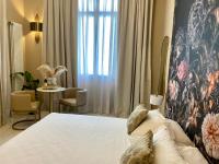 Postel nebo postele na pokoji v ubytování INTOMILAN Galleria Duomo I Boutique & Design Aparthotel