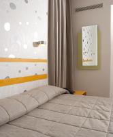 Postel nebo postele na pokoji v ubytování Amazon Hotel
