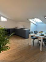 A kitchen or kitchenette at Sky View Apartment