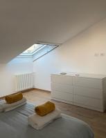 A bed or beds in a room at Sky View Apartment