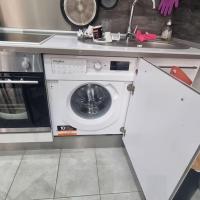 a kitchen with a washing machine and a sink at Charmant appart 4Per Marseille in Marseille