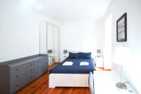 Postel nebo postele na pokoji v ubytování Lisboa Sweet Family Homestay
