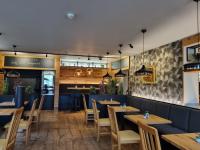 Reštaurácia alebo iné gastronomické zariadenie v ubytovaní Andante Pension & Restaurant