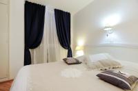 Posteľ alebo postele v izbe v ubytovaní Tinel Rooms Old City Center