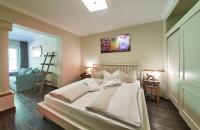 Posteľ alebo postele v izbe v ubytovaní THOMSN Central Hotel & Appartements