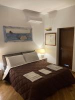 A bed or beds in a room at VILLA AZZURRA beachfront Mondello - Palermo