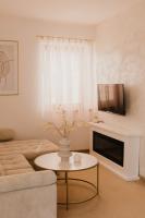 A television and/or entertainment centre at Hill View Apartment Tatragolf