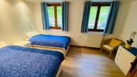 Posteľ alebo postele v izbe v ubytovaní Gîte le petit Château ***