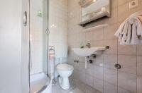 Łazienka w obiekcie Rooms & Apartments Hegic