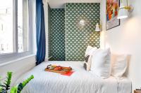 Tempat tidur dalam kamar di Apartments WS H&ocirc;tel de Ville - Beaubourg