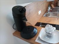 a coffee maker sitting on a counter next to a sink at La Mésange Huppée #8 Gare in Quimper
