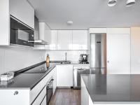 A kitchen or kitchenette at New beach front apartment with large balcony