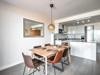 A kitchen or kitchenette at New beach front apartment with large balcony