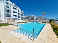 The swimming pool at or close to New beach front apartment with large balcony