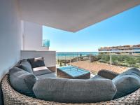 A seating area at New beach front apartment with large balcony