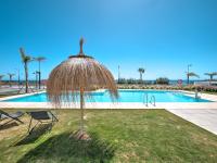 The swimming pool at or close to New beach front apartment with large balcony