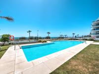 The swimming pool at or close to New beach front apartment with large balcony