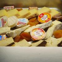 a bunch of cheeses and other foods in a drawer at Hôtel Saint Albert in Sarlat-la-Canéda