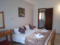 Postel nebo postele na pokoji v ubytování Villa Kaloudis Rooms