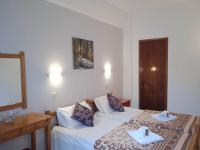 Postel nebo postele na pokoji v ubytování Villa Kaloudis Rooms