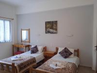 Postel nebo postele na pokoji v ubytování Villa Kaloudis Rooms