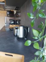 Kuchnia lub aneks kuchenny w obiekcie Appart'Hotel la Savoureuse