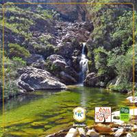 a picture of a waterfall and a river at POUSADA VILA ACONCHEGO- Sossego- Em Meio Há Mata Nativa- by MARCOS MICOZZI in Serra do Cipo