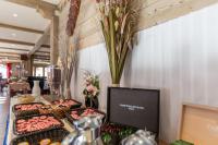 a table topped with trays of food next to a tv at Le Vancouver in La Plagne