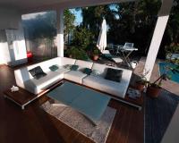 a living room with a white couch and a table at YOU WELCOME VILLA in Case-Pilote