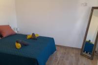 Łóżko lub łóżka w pokoju w obiekcie Appartement lumineux et central
