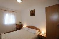 Łóżko lub łóżka w pokoju w obiekcie Apartments Znidarec