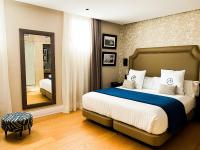 Postel nebo postele na pokoji v ubytování Boutique Hotel Cordial Plaza Mayor de Santa Ana