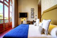 Postel nebo postele na pokoji v ubytování Boutique Hotel Cordial Plaza Mayor de Santa Ana