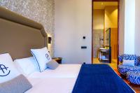 Postel nebo postele na pokoji v ubytování Boutique Hotel Cordial Plaza Mayor de Santa Ana