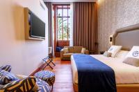 Postel nebo postele na pokoji v ubytování Boutique Hotel Cordial Plaza Mayor de Santa Ana