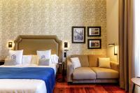 Postel nebo postele na pokoji v ubytování Boutique Hotel Cordial Plaza Mayor de Santa Ana