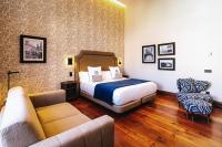 Postel nebo postele na pokoji v ubytování Boutique Hotel Cordial Plaza Mayor de Santa Ana