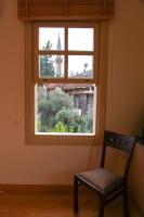 a chair sitting in front of a window at Exceptional Studio Flat near Hadrian&#39;s Gate in Antalya