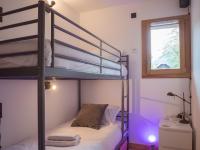 Łóżko lub łóżka w pokoju w obiekcie Bel appart 4* avec jardin privé, à 350m de la Flégère, WIFI, PARKING - FR-1-343-213
