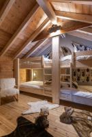 Łóżko lub łóżka w pokoju w obiekcie Luxueux chalet avec vue sur les pistes et le Hohneck