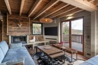 Część wypoczynkowa w obiekcie Luxueux chalet avec vue sur les pistes et le Hohneck
