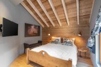 Łóżko lub łóżka w pokoju w obiekcie Luxueux chalet avec vue sur les pistes et le Hohneck