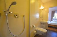 a bathroom with a shower and a toilet and a sink at Apartment Igor - by Alpen Apartments in Piesendorf