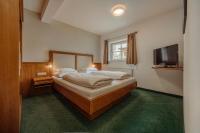Łóżko lub łóżka w pokoju w obiekcie TheResi Appartements