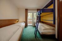 Łóżko lub łóżka w pokoju w obiekcie TheResi Appartements