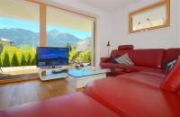 Televízia a/alebo spoločenská miestnosť v ubytovaní Sonnenhaus A - by Alpen Apartments