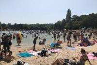 a large crowd of people at a beach at APPARTEMENT COSY Balcon à 30min de PARIS in Cergy