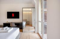 A bed or beds in a room at Bilocale Moderno - City Center