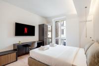 A television and/or entertainment centre at Bilocale Moderno - City Center